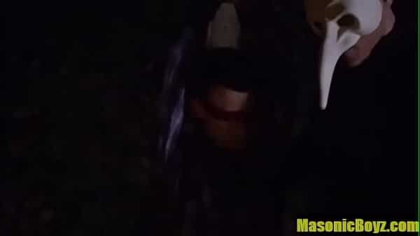 Tiny boy bound to a tree at night