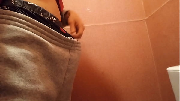 What will this cute skinny twink with a big hard cock do, caught between the urgent need to pee and jerk off ?